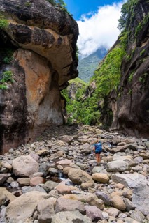 Female hiker in the Tugela Gorge or Tugela Gorge in the riverbed, Drakensberg National Park,