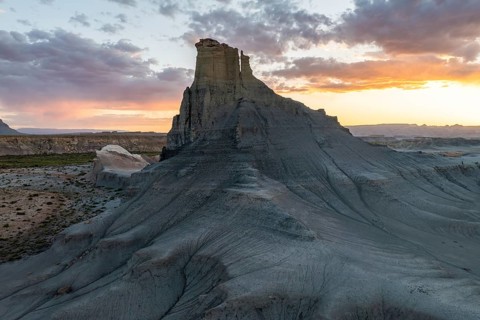 A scenic view captures the breathtaking sunset behind unique eroded rock formations in Utah, USA,