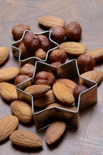 Nuts and cookie cutters, almonds and hazelnuts