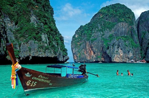 People, longtail boats on Maya Bay beach, known from the movie The Beach, one year in front of the