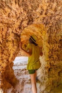 A woman exploring a cave in the Monasterio de Piedra Natural Park, Aragon