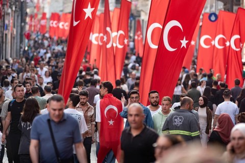 Istanbul, Turkey. October 29th 2023 Crowds flock between the many flags in Istiklal Street,
