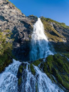 Waterfall at the Bay of Last Hope, fjords and mountains, Puerto Natales, Patagonia, Chile