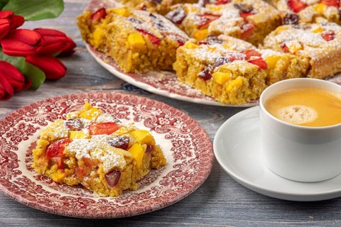 Plate of fruit cake served with coffee