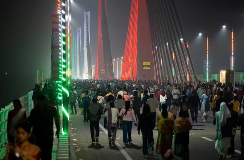 People gather on the newly inaugurated Kumar Bhaskar Varma Setu, a six-lane cable styled bridge