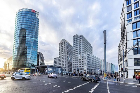 Potsdamer Platz Berlin in the evening with traffic on the streets. When it rains, the skyscrapers
