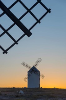 Close-up of a windmill at sunset with another one in the background, windmills, Campo de Criptana,