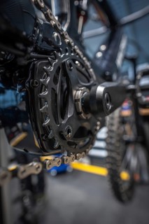 Close-up of a cogwheel and a bicycle chain in a workshop, Waldbike Manufaktur, bicycle workshop,