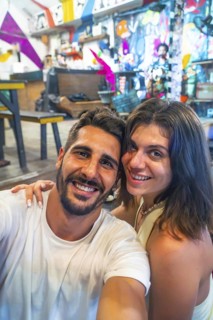 Tourists enjoying their holidays in a vibrant restaurant in siargao island, philippines, capturing