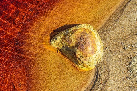 Vivid hues of red and orange characterize the Riotinto River in Huelva, Spain The rich mineral