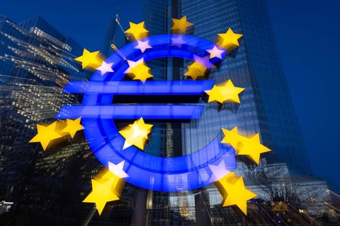 The euro sign in Frankfurt am Main glows in the evening, Frankfurt am Main, Hesse, Germany