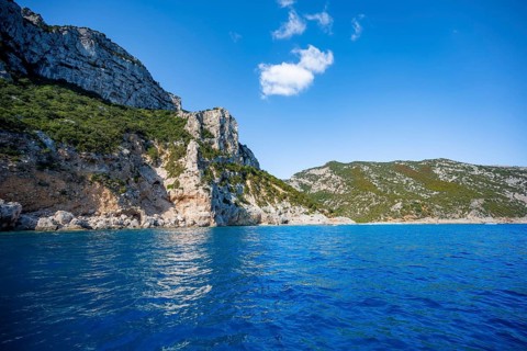 Picturesque rocky coast, cliffs and blue sea, Golfo di Orosei, Baunei, Sardinia, Italy
