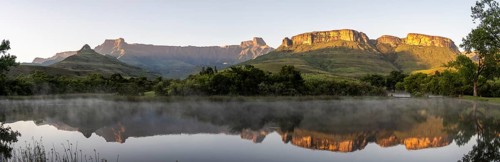 Sunrise, amphitheatre with reflection in the lake, Royal Natal National Park, Drakensberg Mountains