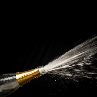 A champagne bottle is opened, sparkling wine, champagne cork flies out, champagne, celebration, New