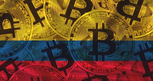 Golden bitcoin coins on Colombia flag background. Bitcoin coins on Colombia flag background