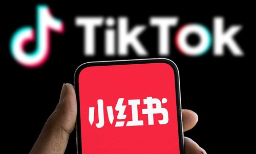 Xiaohongshu (REDnote) logo is displayed on smartphone and tiktok logo in the background
