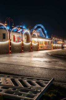 Illuminated circus at night with blue and white arches creating a calm atmosphere, Böblingen,