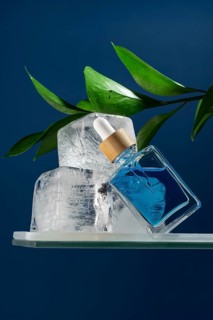 A refreshing face care serum in a dropper bottle for men, emphasizing a cool, invigorating effect.