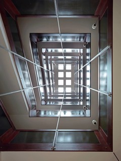 Stairwell in a high-rise building, looking vertically upwards