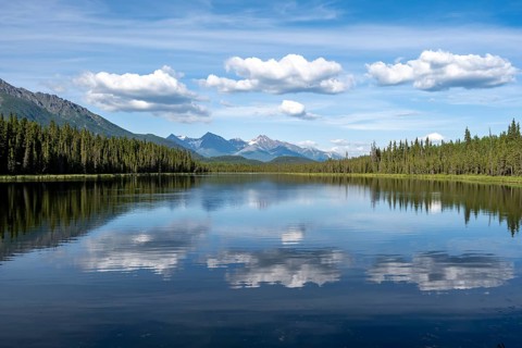 Mountains are reflected in idyllic Crystal Lake, McCarthy Highway, Wrangell St. Elias National