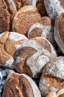 Various types of freshly baked bread, loaves of bread, farmhouse bread, full-size,