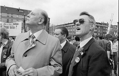 Gelsenkirchen, DEU - 01.05.1983 - DGB rally on May 1st in Gelsenkirchen, two men listen to speeches