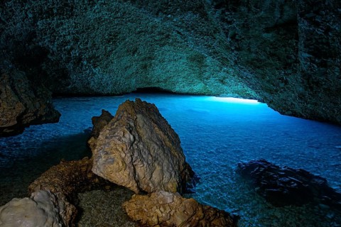 Plava Grotta, cave with bright blue water created by sunlight falling under water. Croatia, Europe,