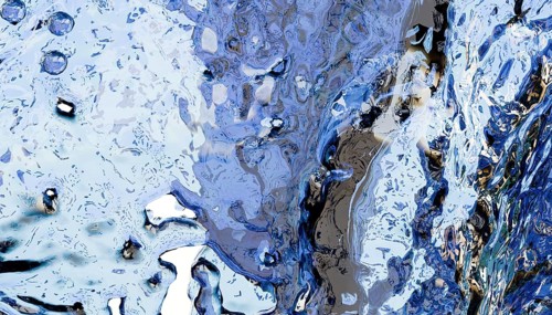 Abstract image showcasing blue and white fluid textures resembling flowing water. Features
