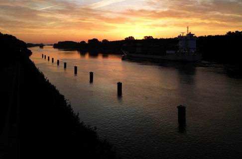 Drone shot, container ship at sunrise in the Kiel Canal, NOK, Kiel Canal, Kiel Canal,