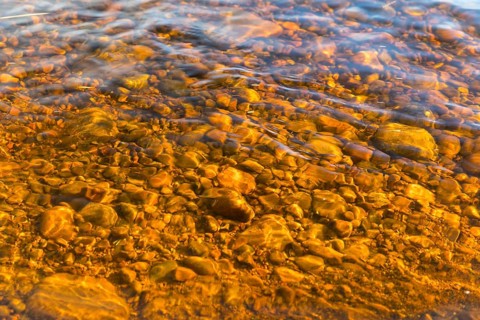 Small stones in the riverbed of Österdalälven River, Älvdalen, Dalarnas län, Sweden