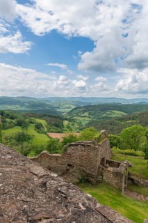 View from the medieval castle ruin Hanstein to the youth castle Ludwigstein and the wooded low