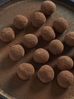 Healthy homemade raw treat, sugar free truffles made of dates, cocoa and nuts. Raw chocolate bliss