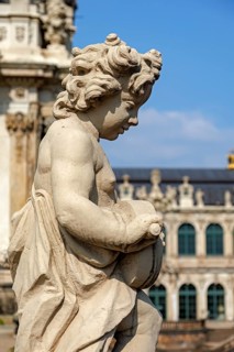 Close-up of an ornate cherub statue in Zwinger Palace, Dresden, Germany. The detailed craftsmanship