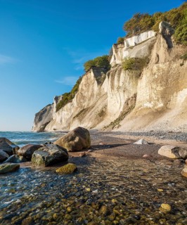 Beach with boulders at the chalk cliffs of Møns Klint on the Baltic Sea, Møn Island, Denmark