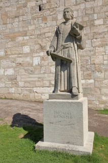 Thomas Münzter memorial with book, stone sculpture, inscription, Mühlhausen, Thuringia, Germany