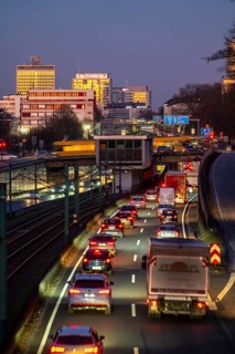 Motorway A40, Ruhr expressway, heavy traffic jam, rush hour, city passage in Essen, skyline of the