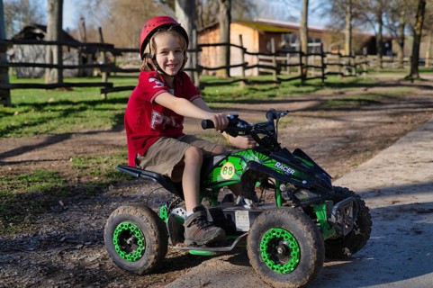Boy, blond, 6 years old, crash helmet, riding quad, children's quad bike, Sonnenhof,