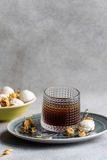 A delectable homemade vanilla mini zephyr-marshmallow filled with rose jam, paired with a