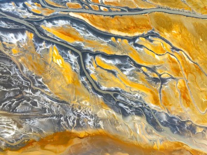 From above, an aerial drone captures the intricate patterns of abstract nature textures, showcasing
