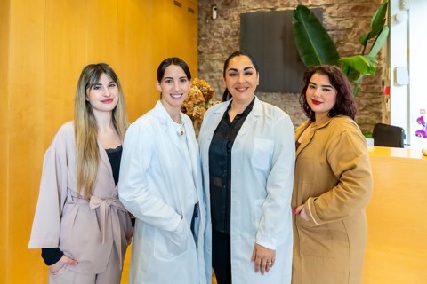 Diverse women medical staff and receptionists smiling confidently, representing professionalism,
