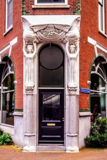 Entrance of the building at Tolhuisstraat 2 in the Katendrecht district, remarkable example of Art