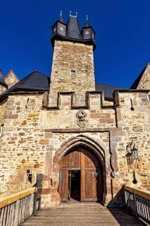 View of the entrance gate to a historic castle with rustic stone elements, Spangenberg Castle