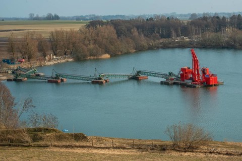 Floating excavator mining gravel below the groundwater level in Skurup municipality, Skåne county,