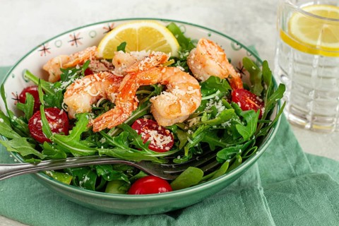 Shrimp salad with arugula and cherry tomatoes, with parmesan cheese, healthy food