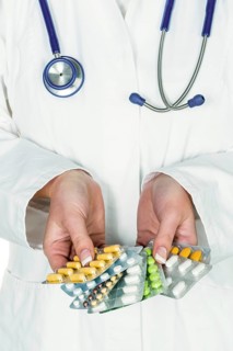 A doctor shows various packs of tablets, tablet addiction, medication addiction Studio shot,