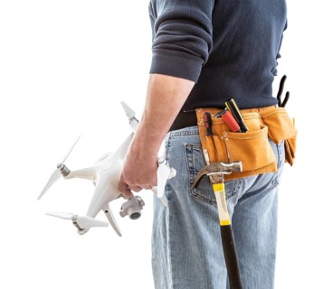 Construction Worker and Drone Pilot With Toolbelt Holding Drone Isolated on White Background