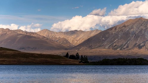 Landscape with lake and mountains in the evening light. Lake McGregor, Tekapo, Canterbury, South