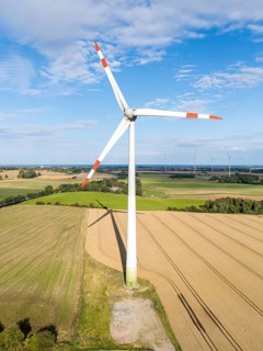 Wind turbine in a wind farm renewable energy wind power wind energy on the Baltic Sea aerial view
