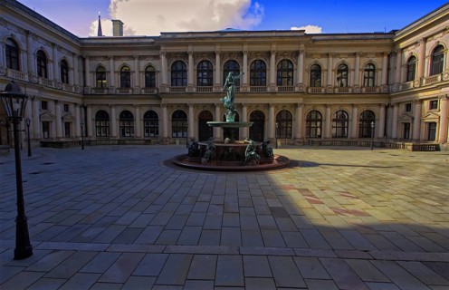 Courtyard of Hamburg City Hall with Hygieia fountain in the center and historic architecture all