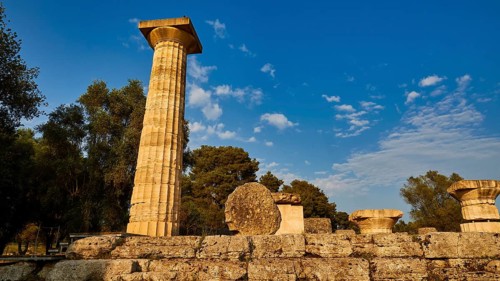 Temple of Zeus, Ancient Column Ruins in a Landscape with Blue Sky and Trees, Archaeological Site,